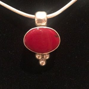 Sterling silver and red coral pendant.
